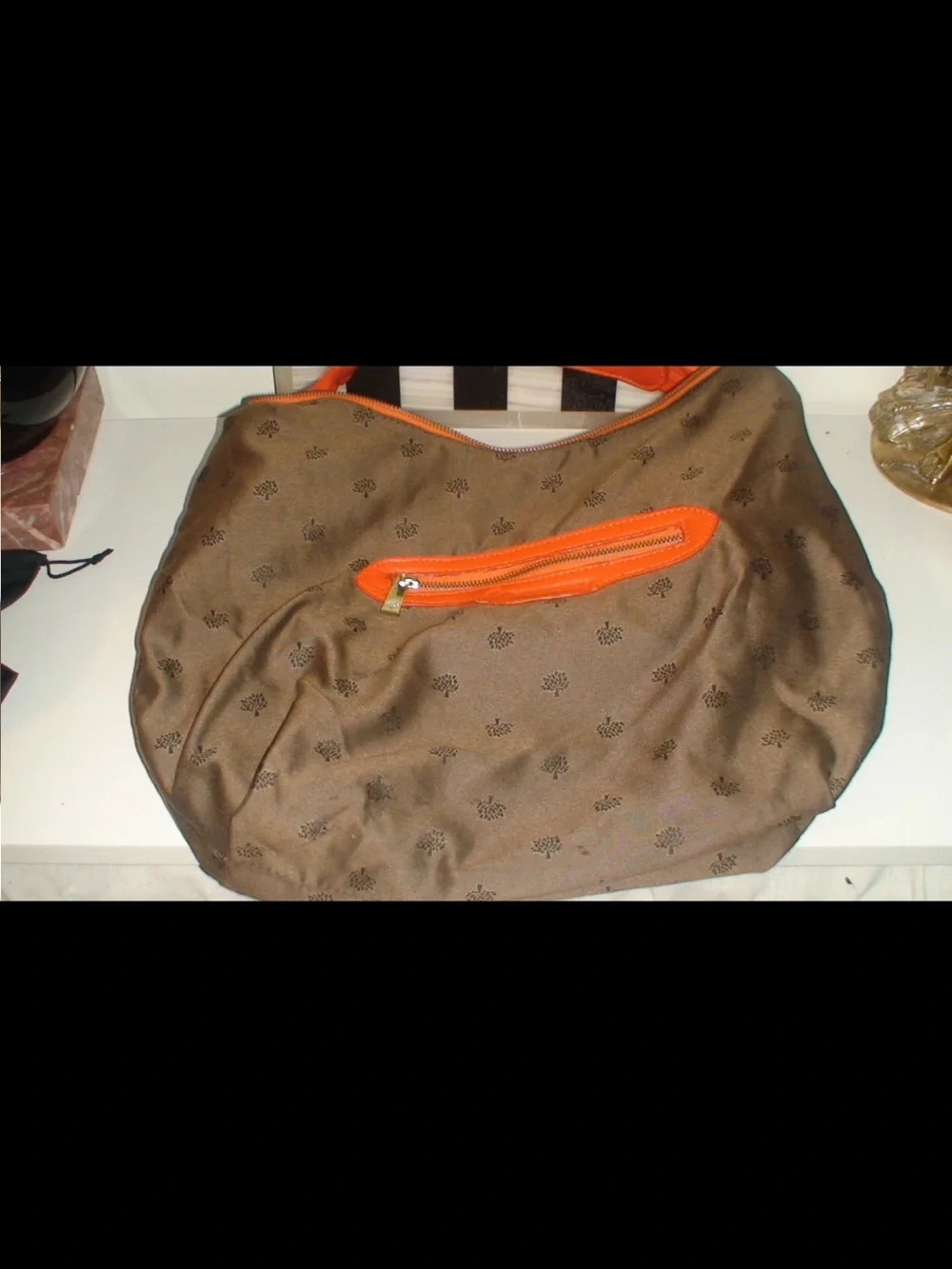 Mulberry Orange Leather Hobo Bag with Tassels and Gold Emblem